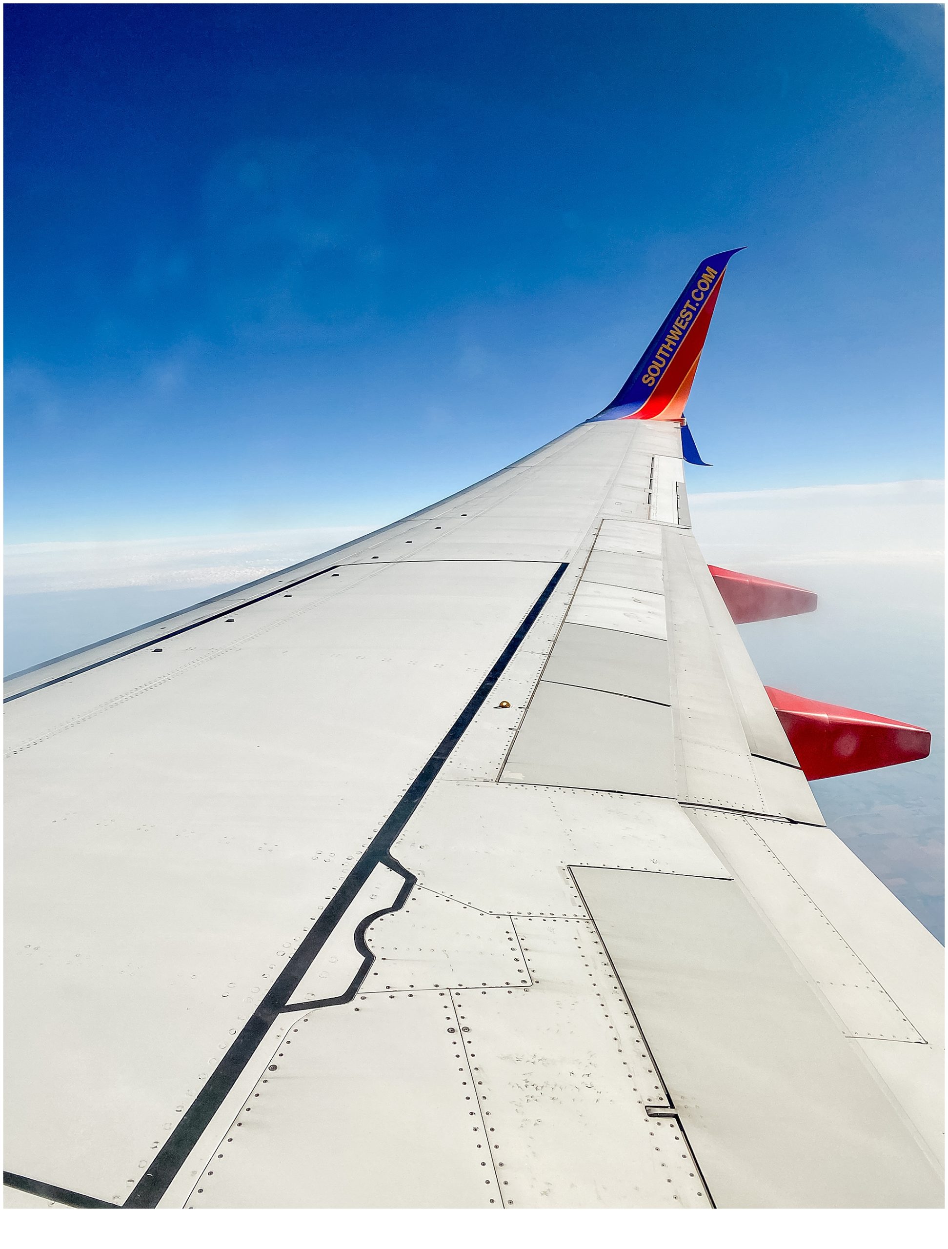 Safety Tips for Spring Break: Southwest Air flying in the sky.