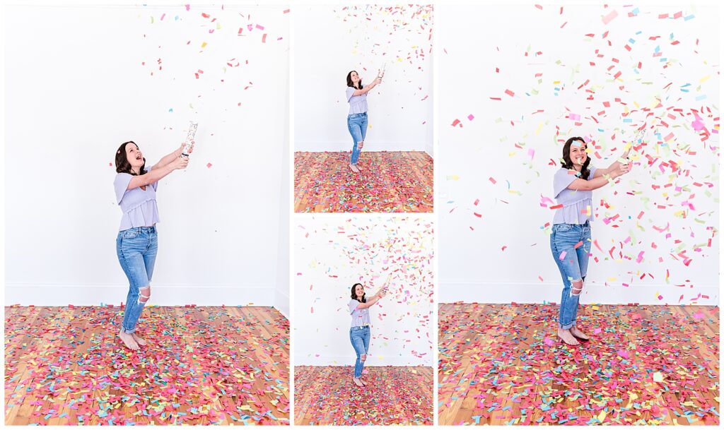 A high school senior spokesmodel wearing jeans and a purple top laughs as she pops a confetti cannon for photos. 