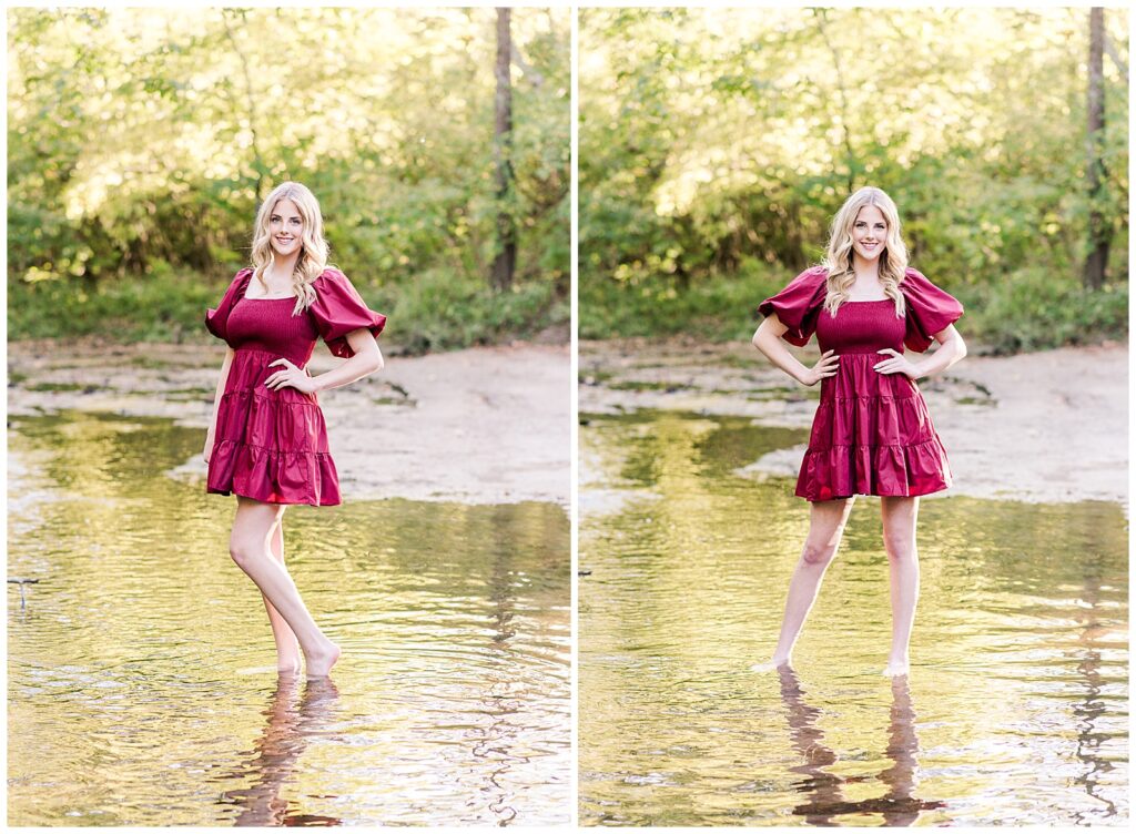 High school senior girl wearing a cranberry-colored dress, standing in the creek, at Ellington Agricultural Center.