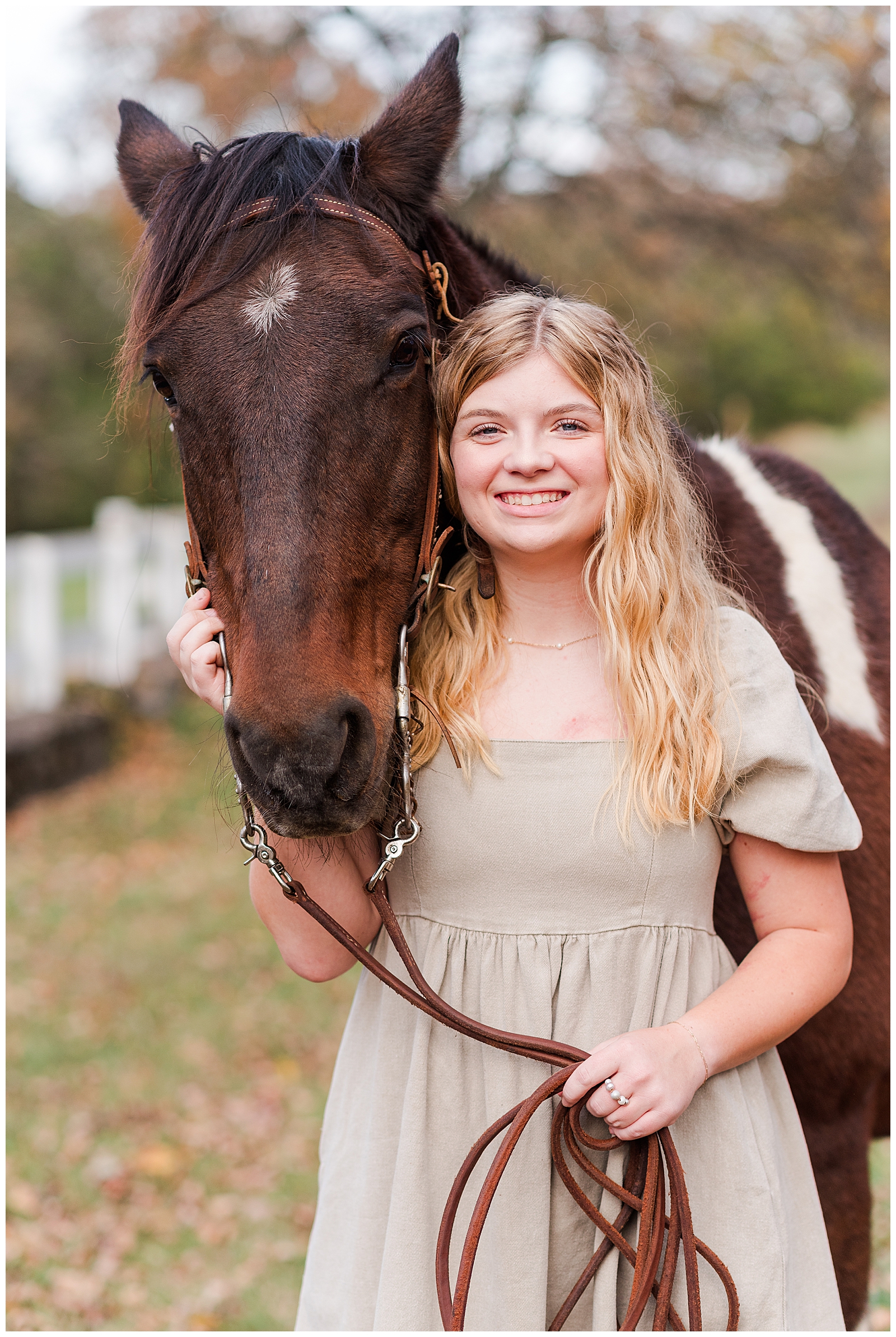 Nashville girl wearing a khaki dress, standing next to a horse during her Equine Senior Session.