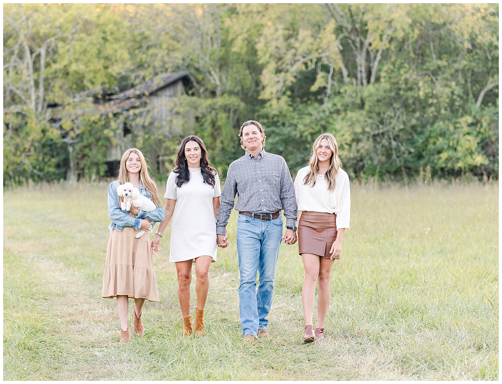 Family walking on a farm during their legacy family portrait session in Nashville, TN