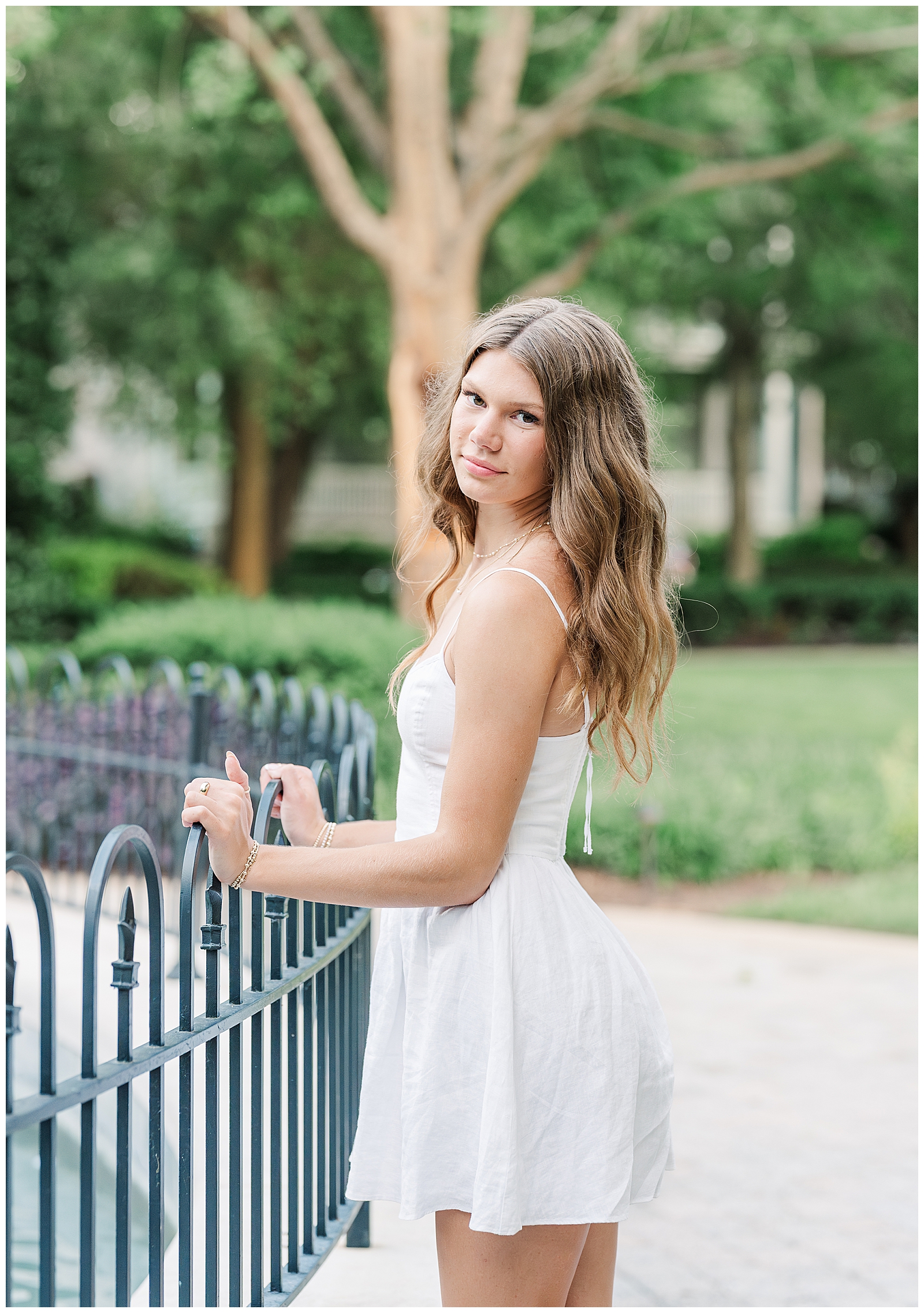 Sentimental senior portraits by the lake and fountain in Franklin, Tennessee