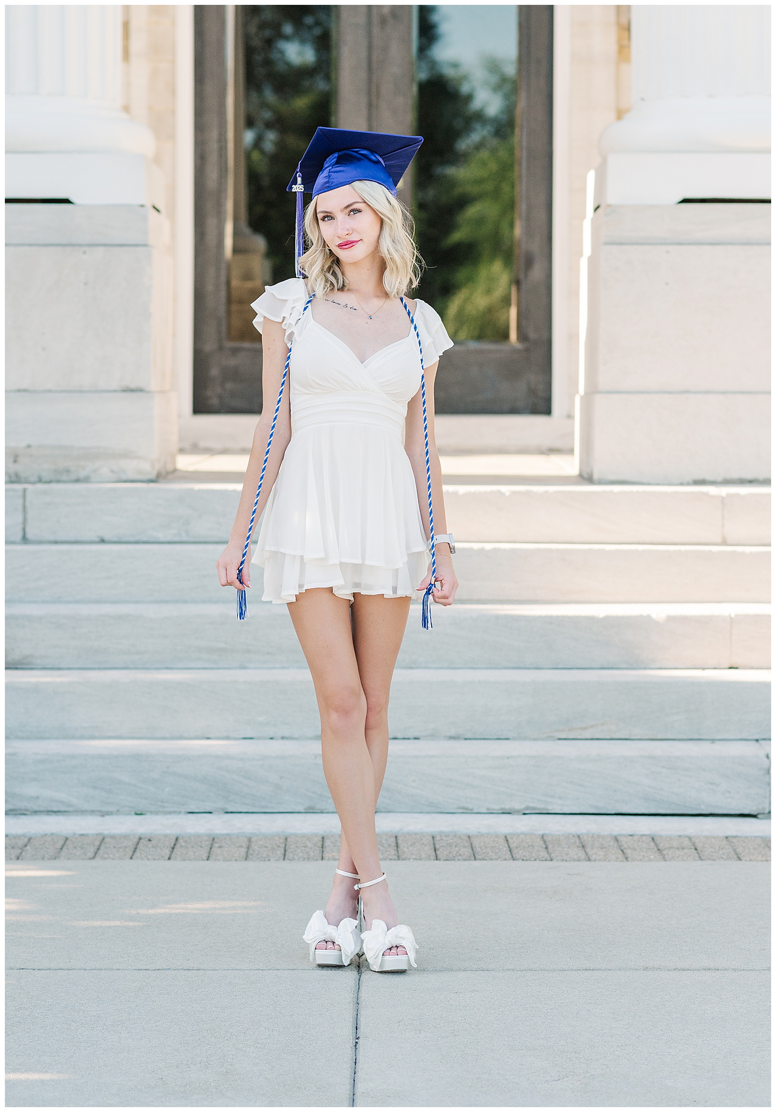 Lilly smiling in her cap and gown during her Lebanon, TN senior graduation photos.